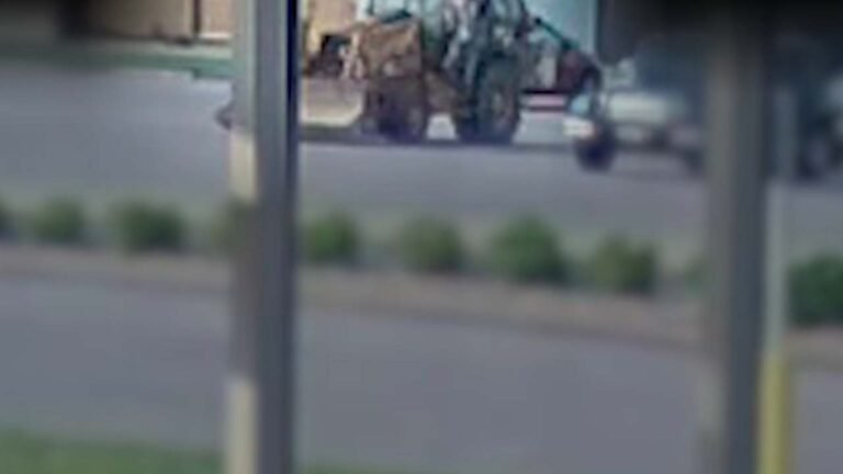 The video shows an Illinois man driving a stolen backhoe to the airport to catch his flight