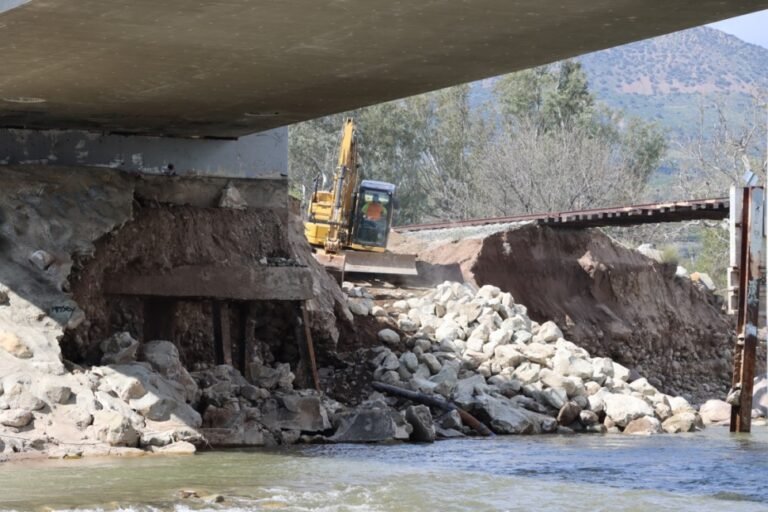 Backhoes and earth movers begin work on the old telegraph bridge