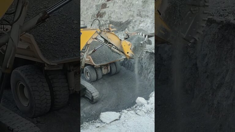 Komatsu PC4000 Excavator Loads XCMG Dump Truck